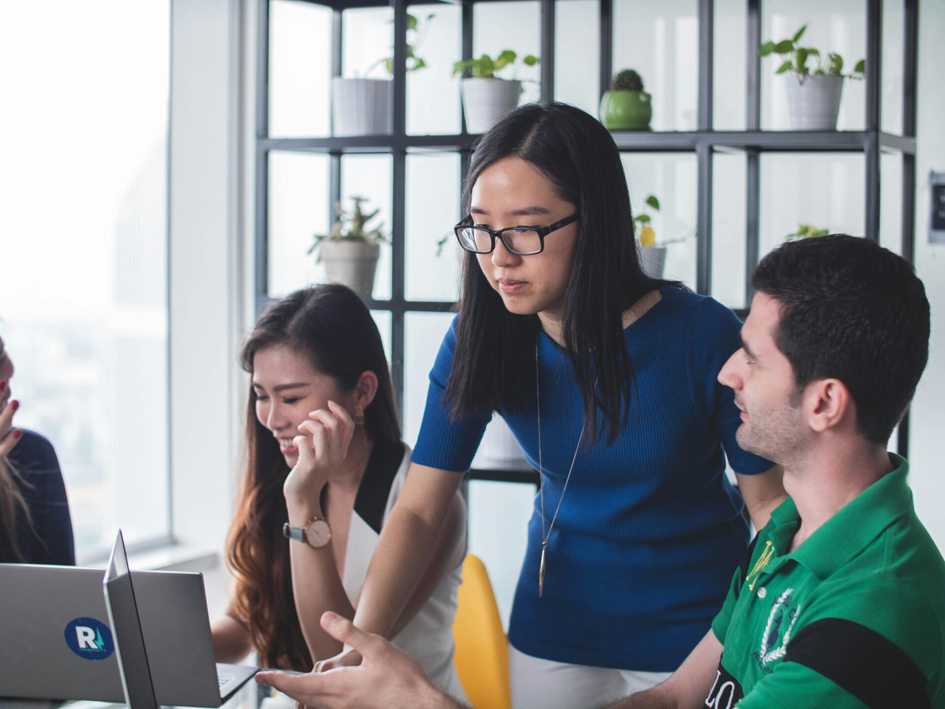 Three coworkers working together in an office.